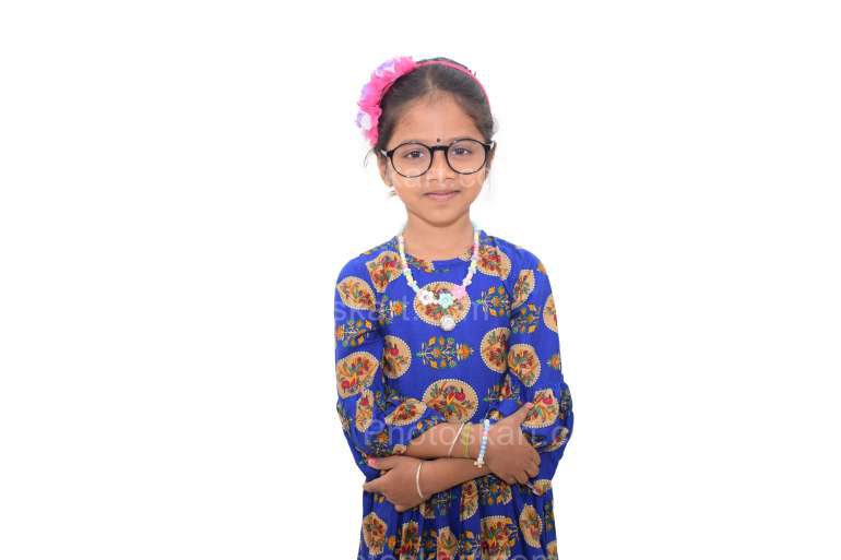 A Cute Indian Girl Standing With Eyeglasses Stock Image