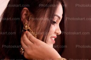 a-smiling-beautiful-indian-girl-hands-on-earing-image