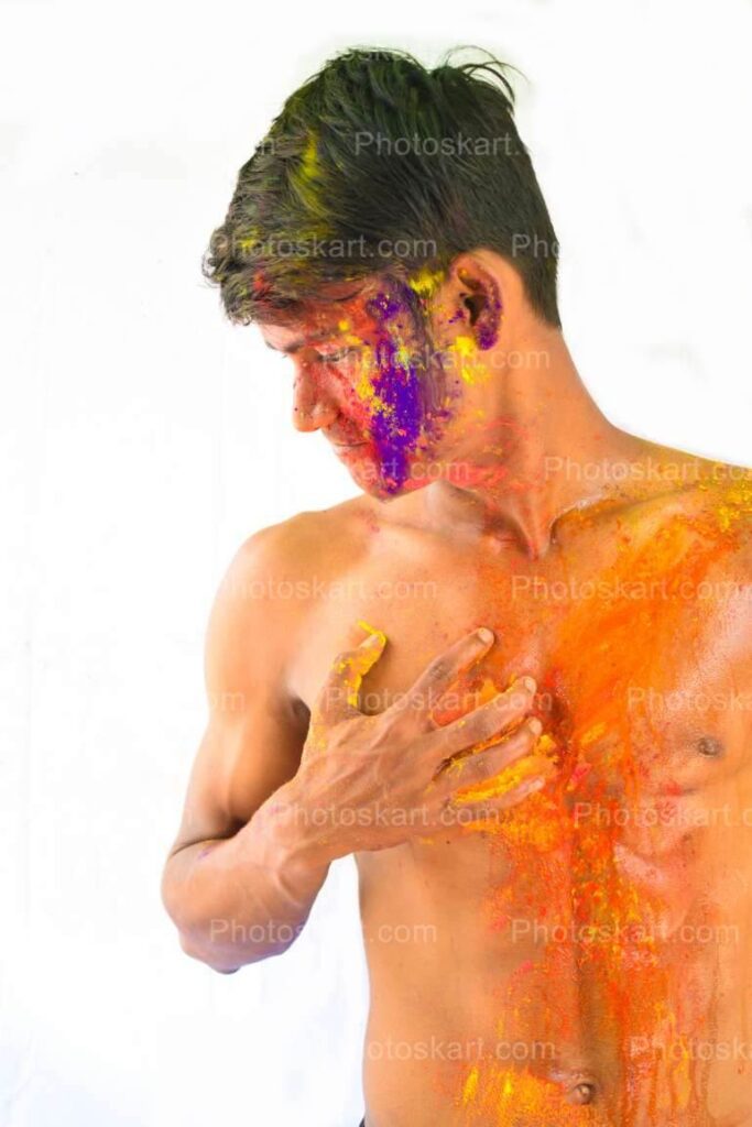 An Indian Boy Showing His Abs During Holi Stock Image