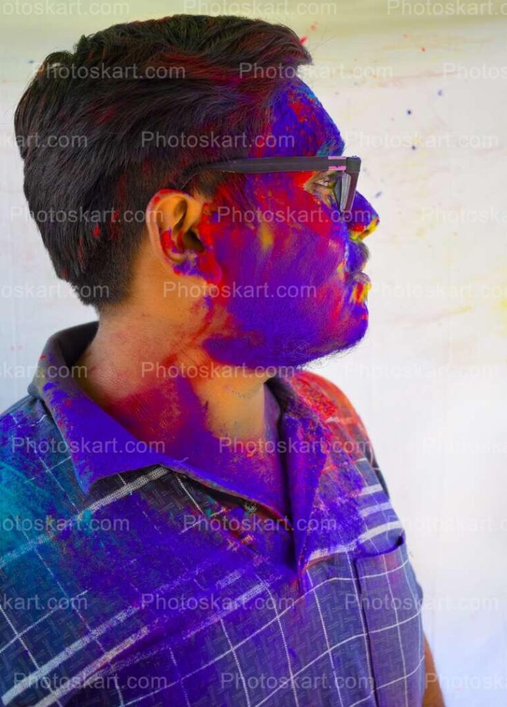 An Indian Boy Side Face Covered With Holi Colours Stock Image