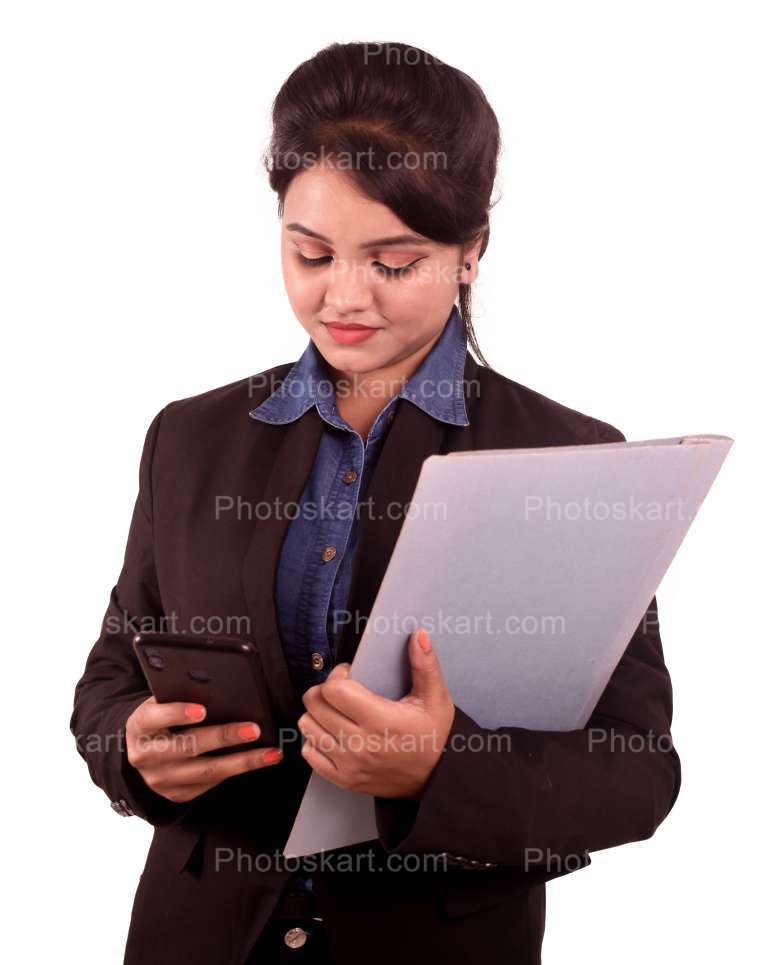 An Indian Corporate Women Holding A File While Checking Her Phone On Other Hand Images