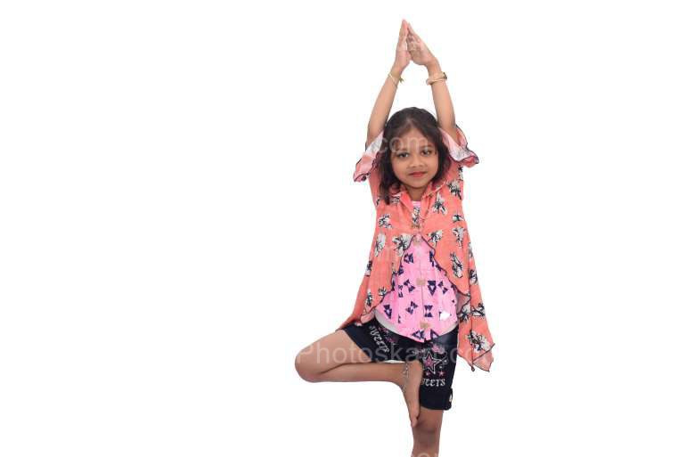 An Indian Little Girl Standing On One Leg In Yoga Pose