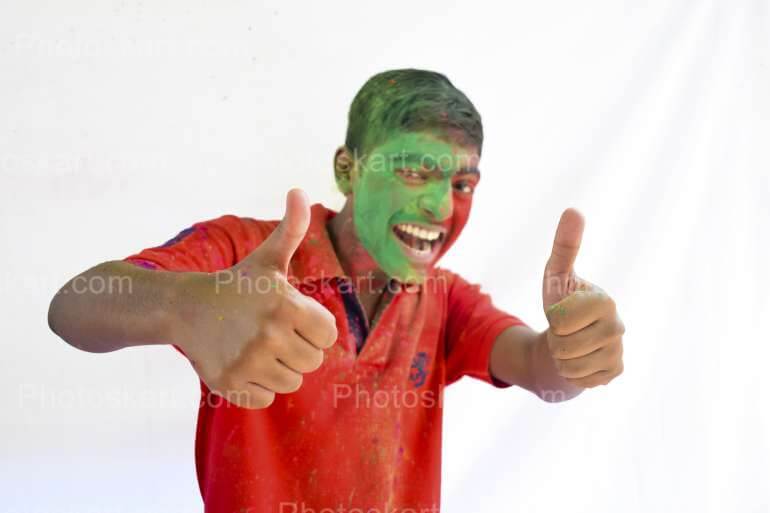 Happy Coloured Face Indian Boy Playing Stock Image