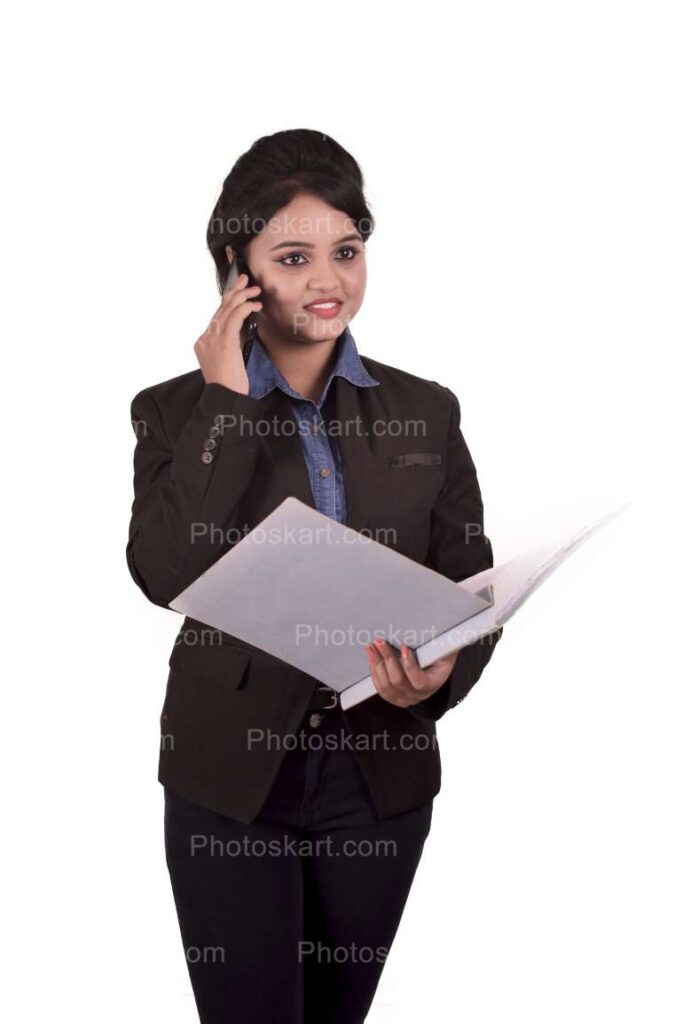 Indian Corporate Women Speaking On Phone While Holding A File Images