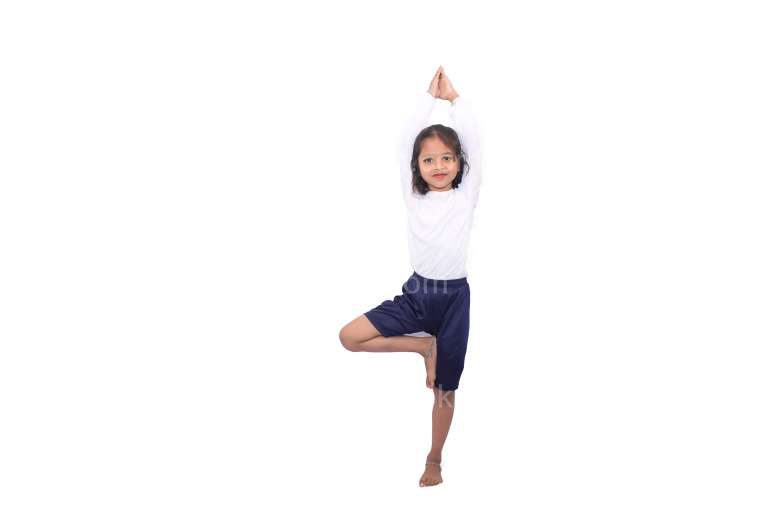 Indian Little Girl Standing On One Leg Yoga Pose Stock Image