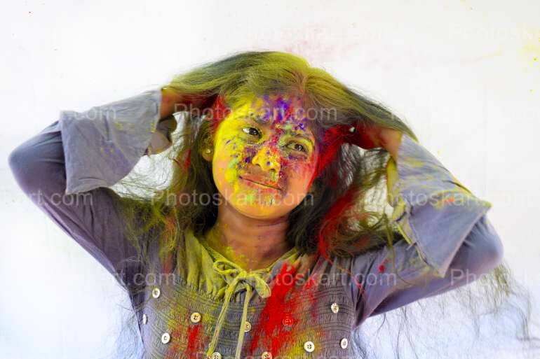 Young Indian Bengali Girl Celebrating Festival Of Colours