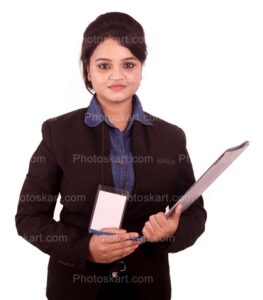 young indian corporate girl holding file in one hand and pen in other hand wearing a identity card stock image