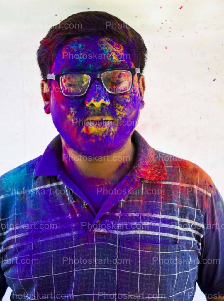 Young Indian Man Celebrating Holi Festival In India Stock Photo
