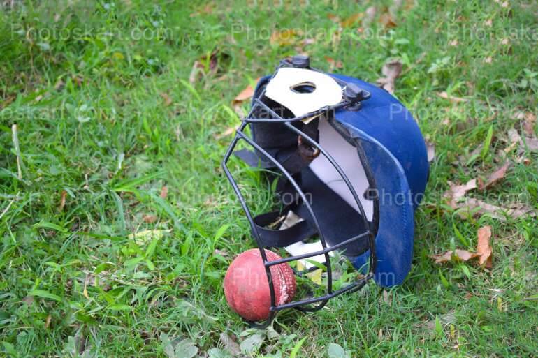 Cricket Ball Helmet In A Ground Stock Image