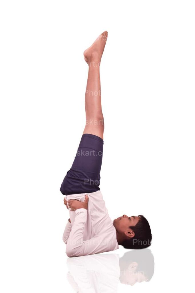 Indian Teenage Boy Doing Sarvangasana Stock Image