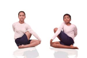 indian-boy-and-girl-doing-yoga-on-white-background