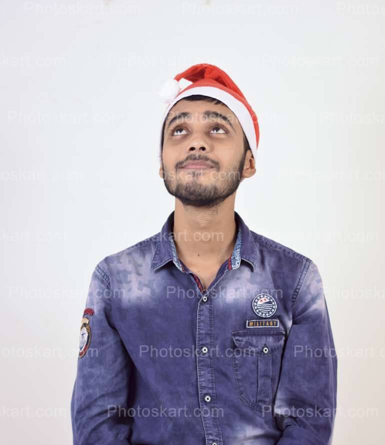 funny indian boy wearing santa cap | Photoskart