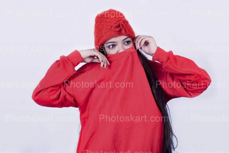 Indian Girl Hiding Her Face With Sweater