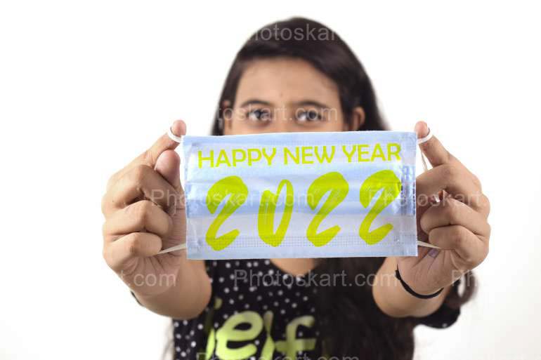Indian Girl Wearing A Mask With Happy New Year