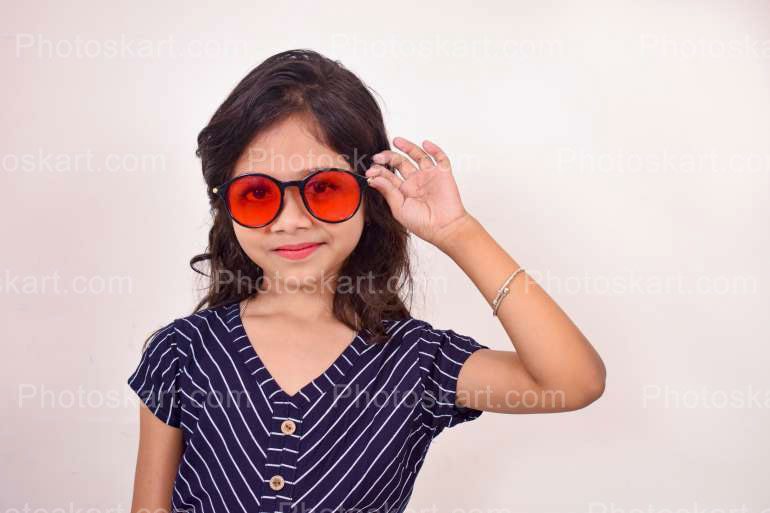Stylish Indian Cute Child Girl With A Red Glass