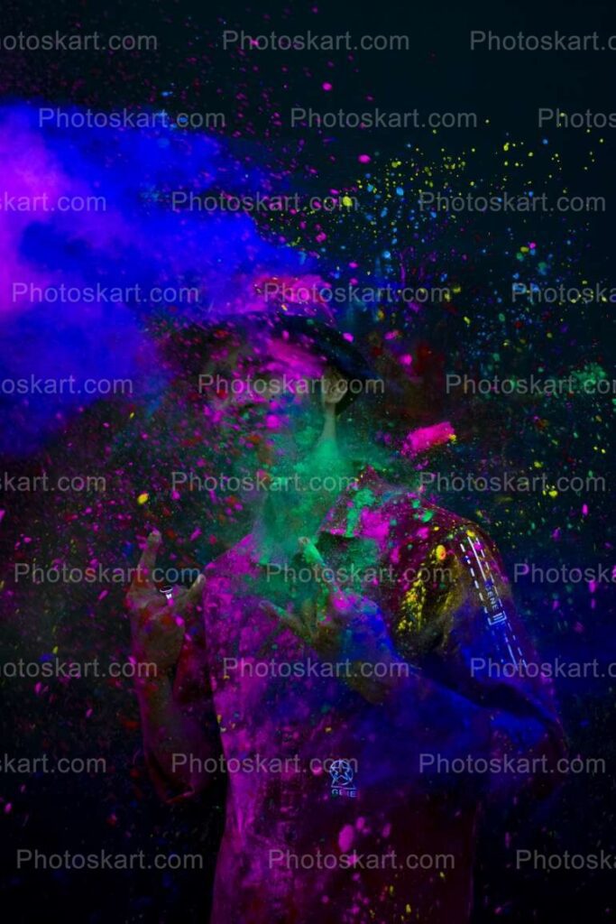 A Boy With Splashes Of Colour At Holi Festival
