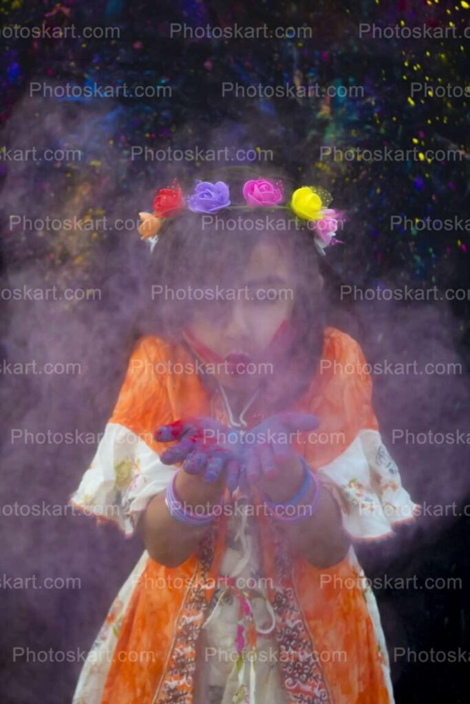 A Little Girl Having Fun With Holi Colors