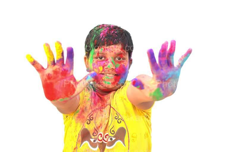 a smart indian boy celebrate holi festival