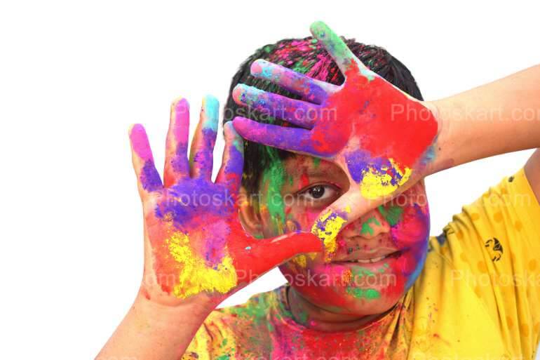 A Smart Indian Boy Celebrate Holi With Coloful Face