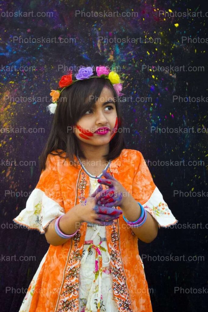 Beautiful Little Indian Girl Playing Holi
