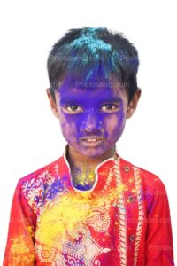 cute-indian-boy-face-colored-with-blue-color-in-holi