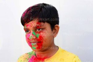 cute indian boy innocent looks in holi