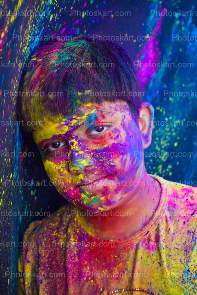 Happy Holi day concept. Funny satisfied girl with colorful powder on face,  clothes and palms, being in high spirit, celebrates traditional spring  festival, poses against purple wall with free space Photos |