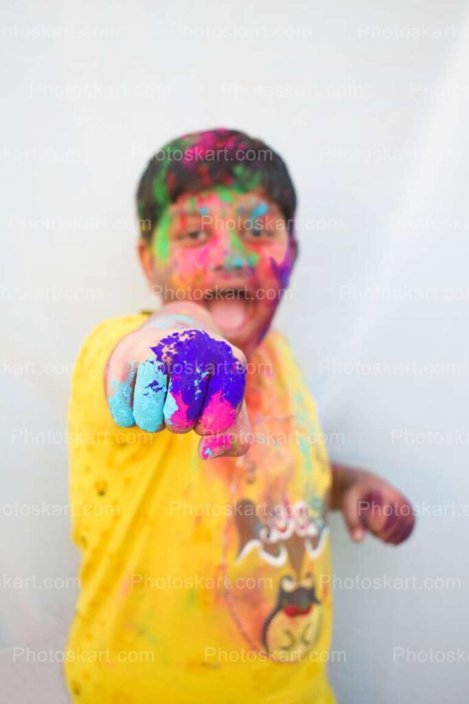 Cute Indian Boy Posing With Colorful Hand Punch