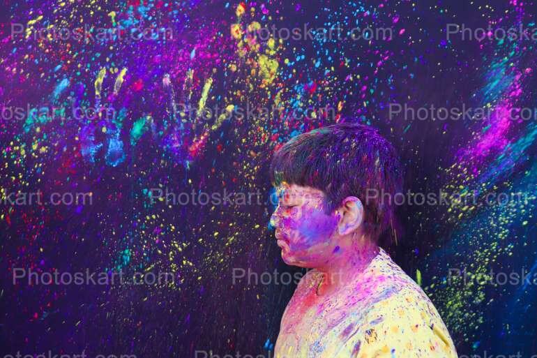 Cute Indian Boy With Coloful Holi Background