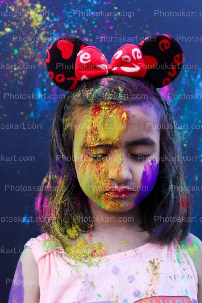 Cute Indian Girl Enjoying Holi Festival Stock Photo