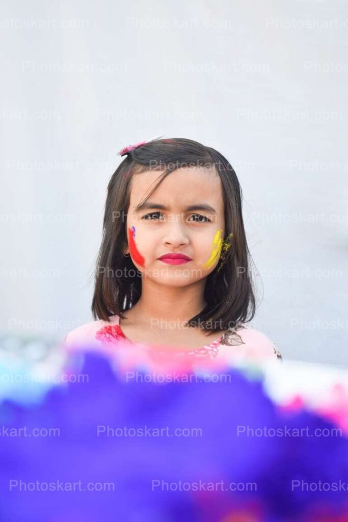 Cute Indian Girl Face In Holi Stock Image