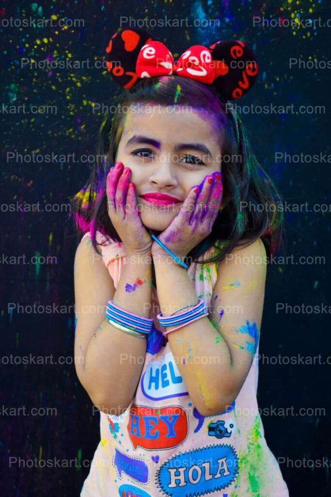Cute Indian Girl Posing In Holi Festival Stock Photo