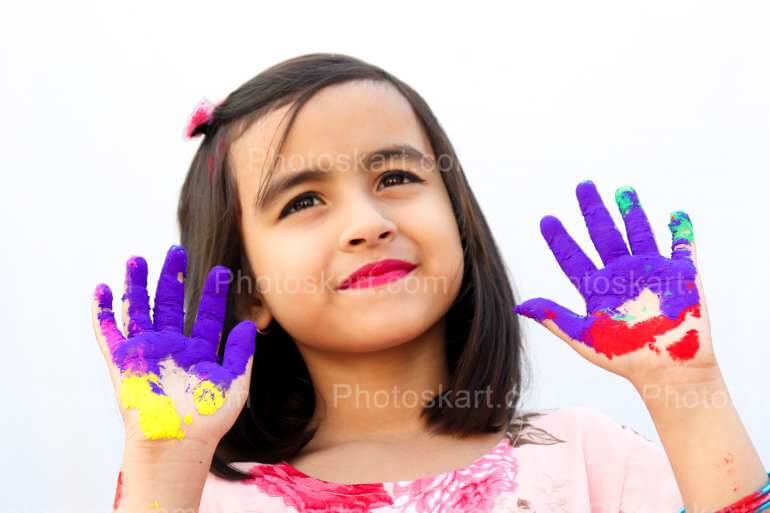Cute Indian Girl Smiling Face In Holi Festival