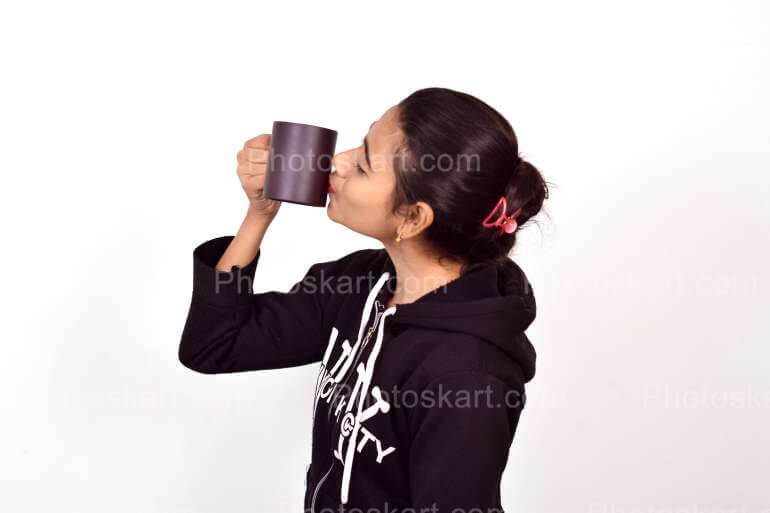 Indian Girl Kissing The Coffee Mug Stock Image