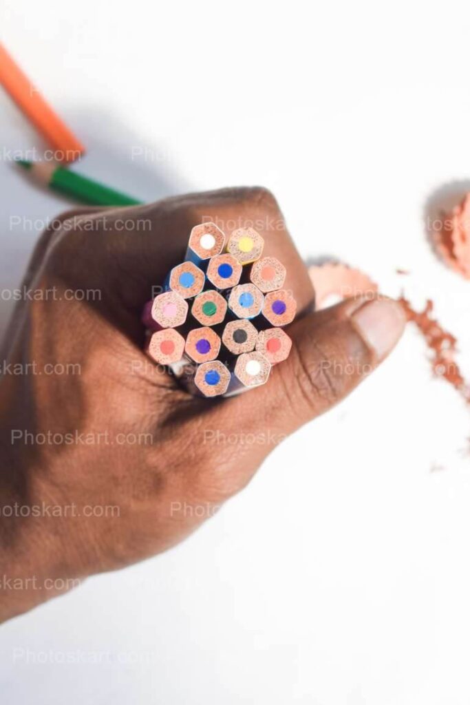 Man Hand Holding Colored Pencils Stock Images