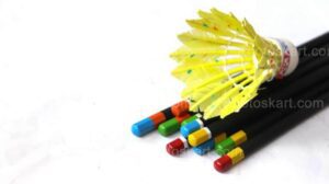 pencils and a badminton cock stock images