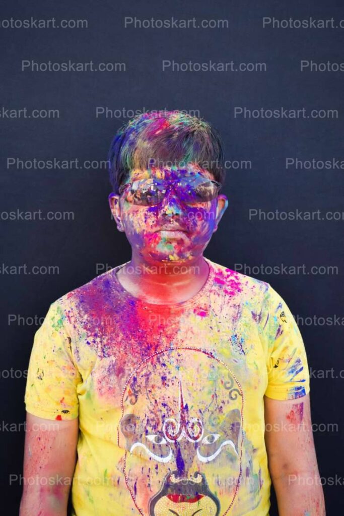Smart Indian Boy Colorful Face With Sunglass In Festival Of Colors