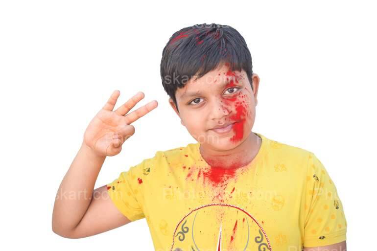 Smart Indian Boy Posing In Holi Festival Stock Photo