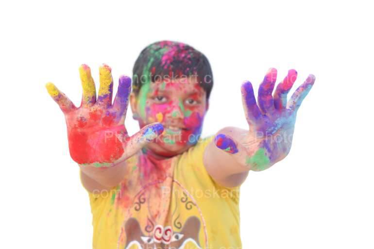 Smart Indian Boy Showing Colorful Hands In Holi