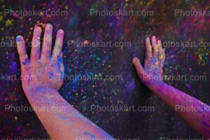 two hands on colorful holi background stock image