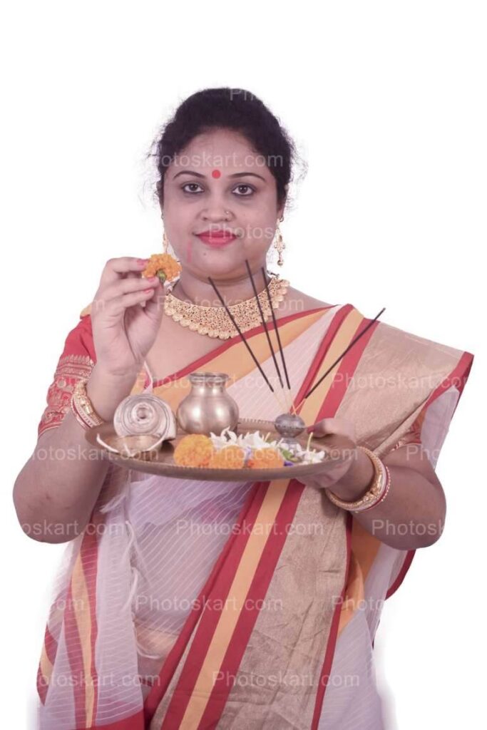 An Indian Model Holding Puja Thali And Flower With Agarbatti Stock Image