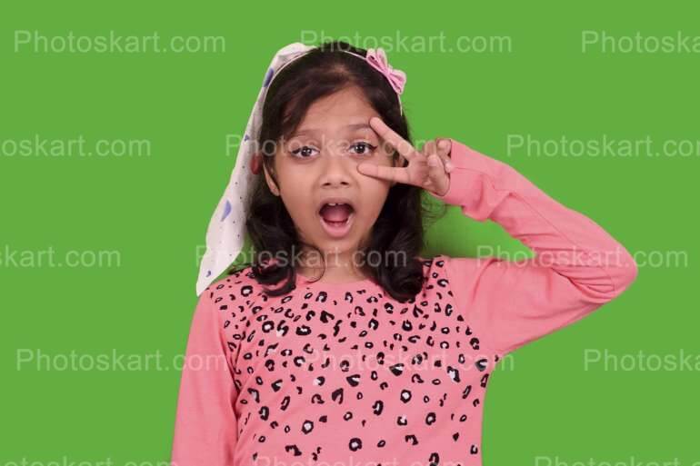 Cute Indian Girl Posing In Fornt Of Green Screen Stock Image