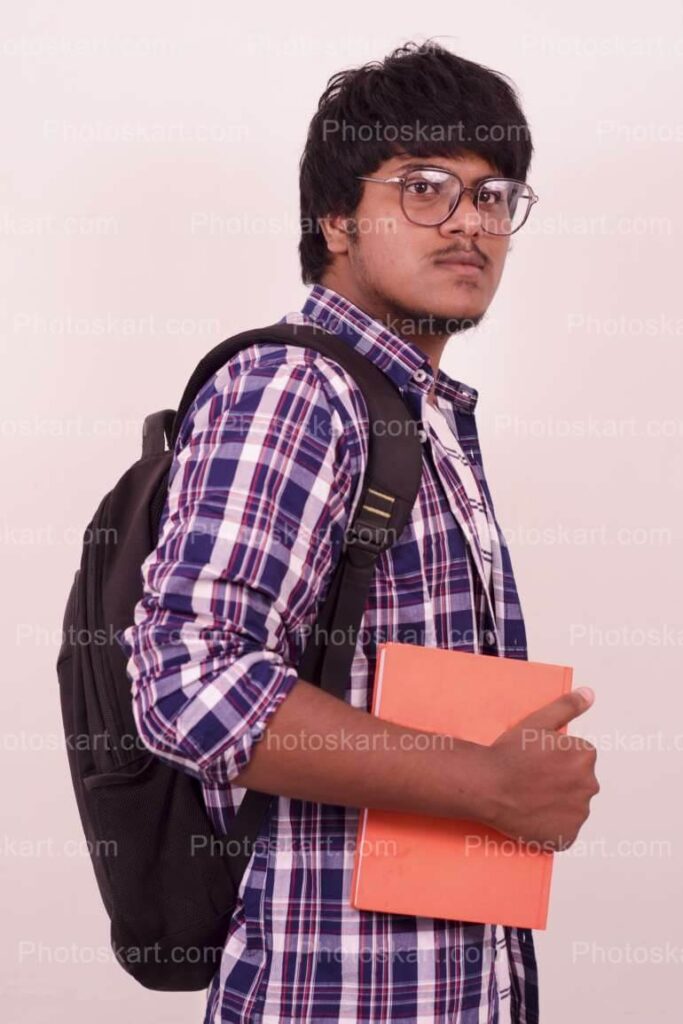 Indian College Boy Casual Side Pose With Book Stock Image