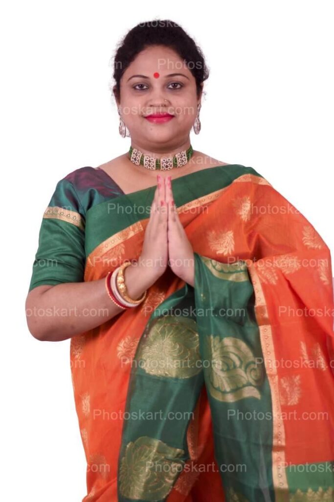 Indian Woman Doing Namaste And Wearing Traditional Saree
