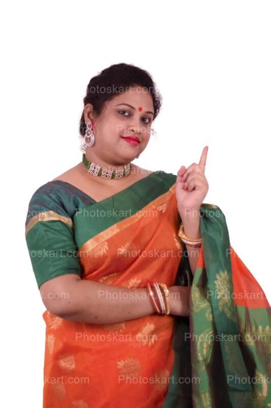 DG91724240922, indian woman pointing with her fingers stock image, indian woman, saree, saree posing, indoor, indoor photoshoot, traditional photoshoot, desi, mohila, vodro mohila, indian woman, smart woman, stock image, royaltyfree image, stock photos, photo, portfolio, model, desi model, indian model, model with saree, model with makeup, beautiful indian woman, beautiful