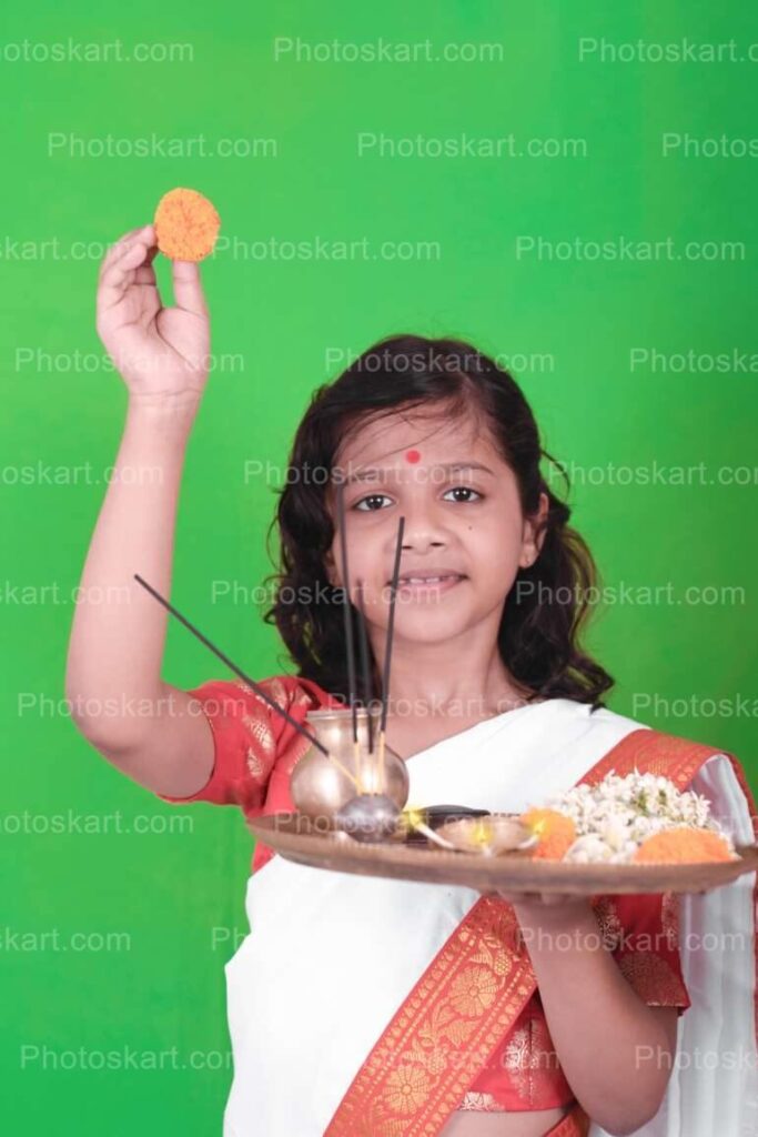 Little Bengali Girl With Puja Thali And Holding Flower Image