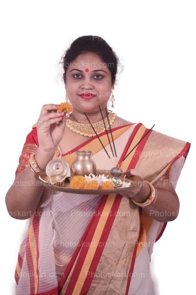Woman In A Bengali Sari Holding Puja Thali Royalty Stock Image