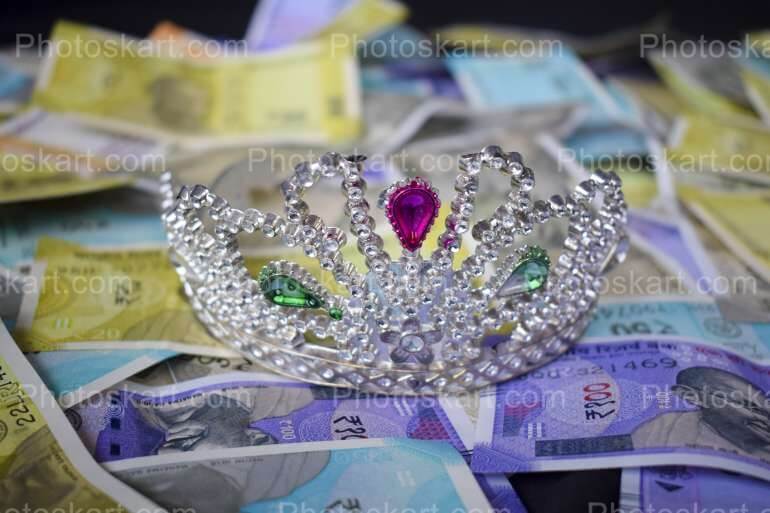 A Bunch Of Indian Currency With A Crown Image