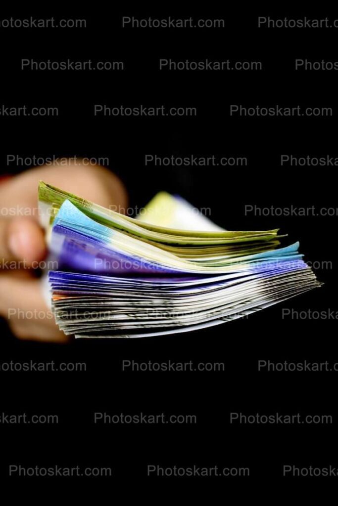 A Bunch Of Money In Holding Hands Free Image