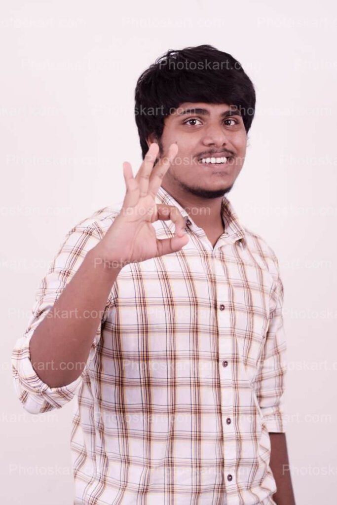 Indian Boy Showing Awesome Symbol Stock Photo
